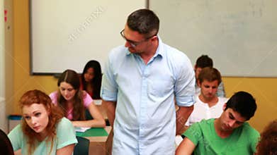 Lecturer smiling at camera in classroom