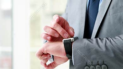Businessman using his smart watch