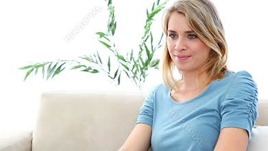 Blonde woman watching TV