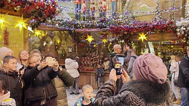 Minsk Belarus December 5 2025 Visitors take photos at an