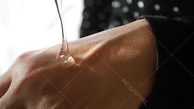 pouring aloe vera gel on hand