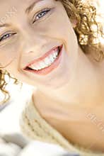 Close-up of woman's smiling face.