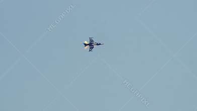 F-16 Fighter Jet Performs Aerobatics in Blue Sky