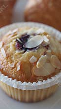 Freshly baked muffin with almond topping