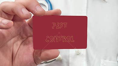PEST CONTROL words appear on a red card in the man&#x27;s hand. Health and productivity concept