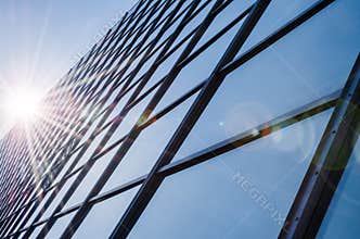 Glass and steel - mirrored facade of modern office building