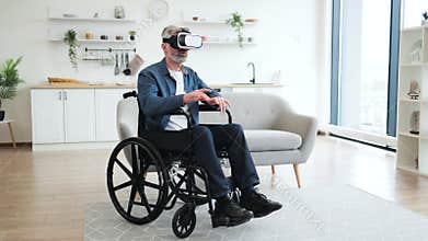 Senior man in wheelchair using VR headset in a modern home interior