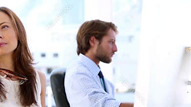 Creative woman thinking with her coworker in the bottom
