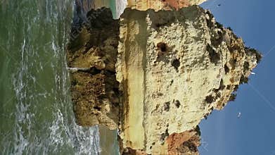 Aerial view on rock and waves in Algarve Portugal