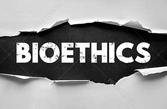 BIOETHICS text behind torn paper background. Concept about moral principles in medicine, biology, and scientific research. Simple