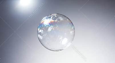 A Single Translucent Soap Bubble Floating in a Softly Lit Environment