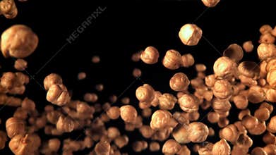 Chickpeas fly and fall. Filmed on a high-speed camera at 1000 fps.