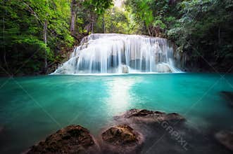 Thailand outdoor photography of waterfall in rain jungle forest.