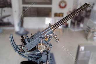Historic naval artillery displayed in a museum showcasing maritime warfare technology from the 20th century