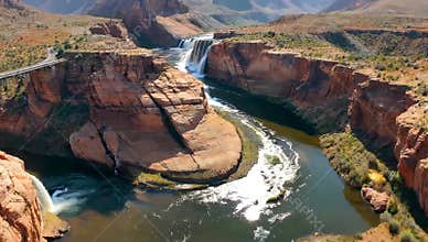 Scenic view of Glen Canyon Dam and Colorado River with waterfalls and red rock formations
