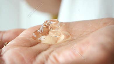 pouring aloe vera gel on hand