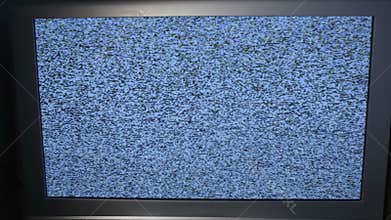 Tracking shot of TV screen with noise