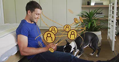 Man wearing blue tee using smartphone tablet in bedroom, dog sniffing, network overlay, copy space