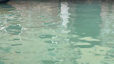Venice, buildings reflected in the water of a canal