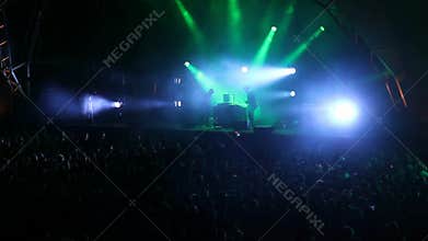 Huge crowd dancing at a DJ show, with great lightning effects. Barcelona