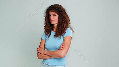 Woman crossing arms frowning feeling offended angry upset displeased negative emotional attitude