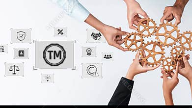 Collaborative Business Strategy with Wooden Gears and Icons Representing Branding, Law, Quality, and Teamwork. Raster