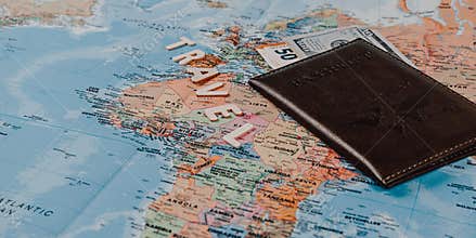 Lvivi Ukraine 11.26.25 Travel preparations with a map, passport, and money on a table