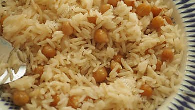 Enjoying delicious rice with chickpeas for lunch