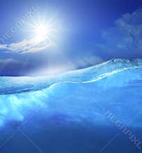 Under clear sea blue water with sun shining on sky above use for