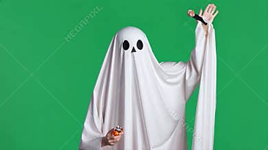 Spooky Season: Ghost in Halloween Costume with Candy