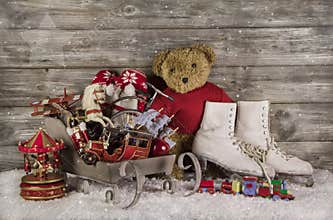 Old children toys on wooden background for christmas decoration.