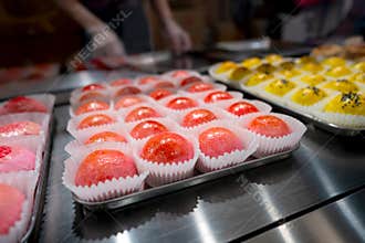 Assorted Colorful Asian Pastries on Display in a Bakery