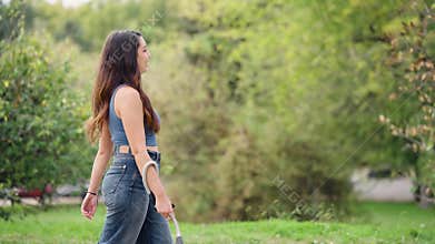 Young woman with visual impairment walking in park