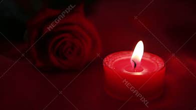 Pink candle and red rose