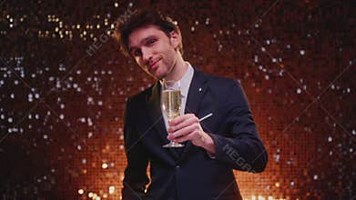 Man hold flute glass of champagne. Celebrates success, victory or winnings, wishes you happy new Year or Christmas. Cheers