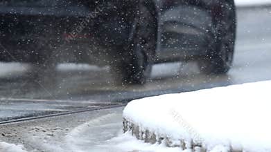 Details of actual snow falling at daytime in European city complicated life