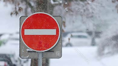 Details of actual snow falling at daytime in European city complicated life