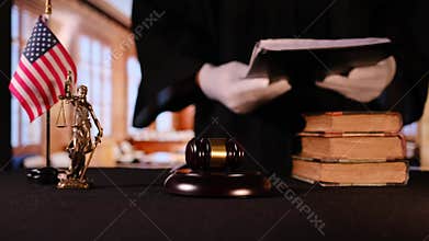 American judge reading legal documents in courtroom