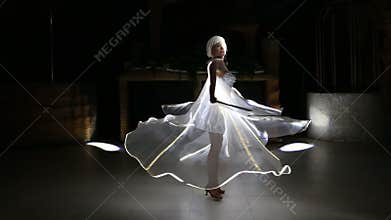 Actress girl in white LED wings