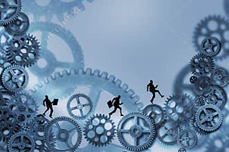 Business men running on gears