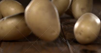 Super slow motion, Rustic Potatoes Rolling On Wood Slow Motion Kitchen Study