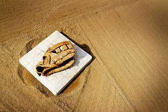 Leather Baseball Mit or Ball Glove on Base on Diamond or Field f