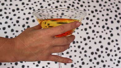Hand taking a Cocktail Drink