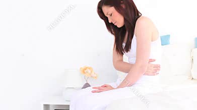 Young brunette having a bellyache