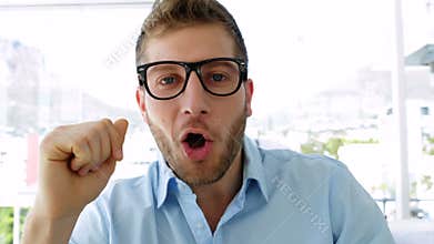 Handsome businesswoman talking to camera