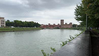 Castelvecchio bridge over adige river in verona on cloudy day