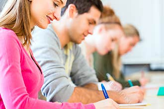 College students writing test or exam