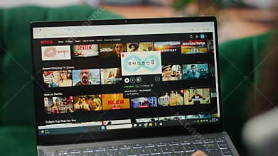 Bucharest, Romania - July 30th 2024 - CEO browsing Netflix streaming platform