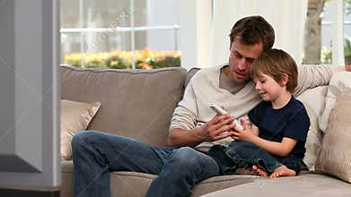 Little boy playing with a remote control