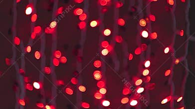 Soft red bokeh lights blurring together, generating enchanting festive mood with magical christmas background for seasonal design